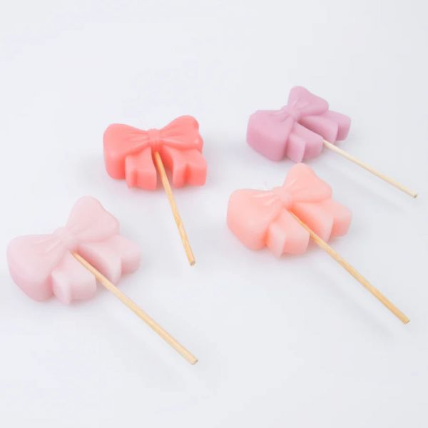 Lot de 4 bougies Noeuds roses