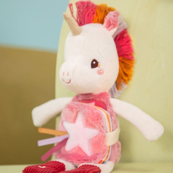 Peluche phosphorescente avec livre en tissu Lena