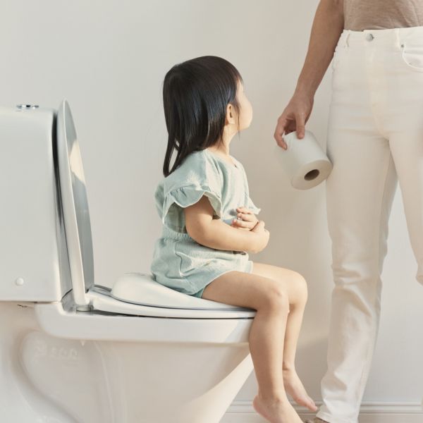 Réducteur de toilette blanc et gris