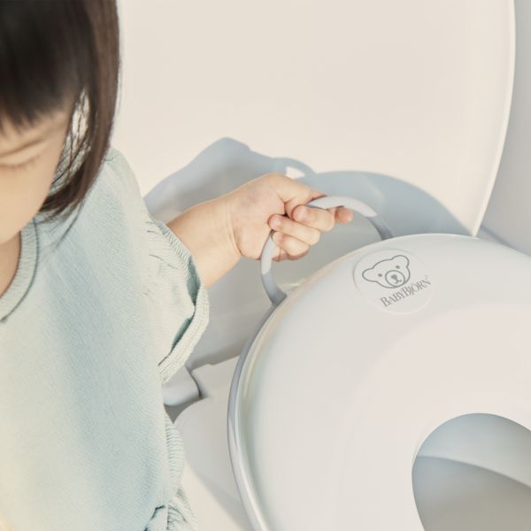 Réducteur de toilette blanc et gris