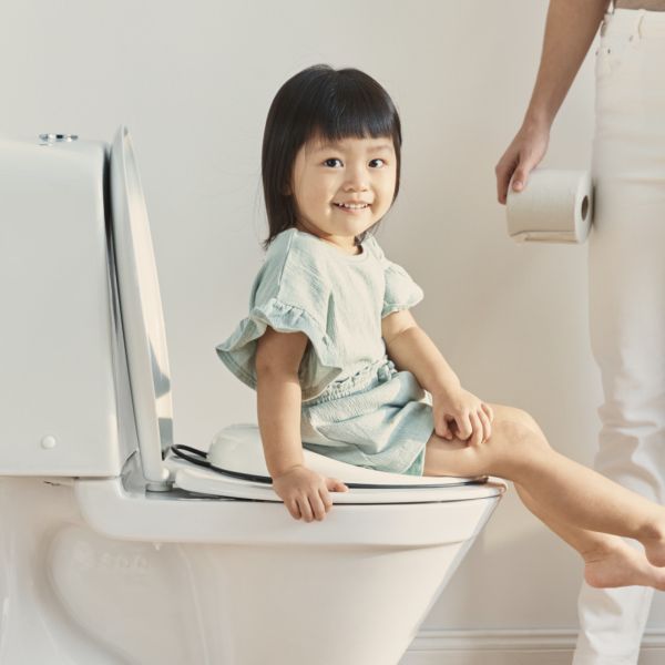 Réducteur de toilette blanc et noir