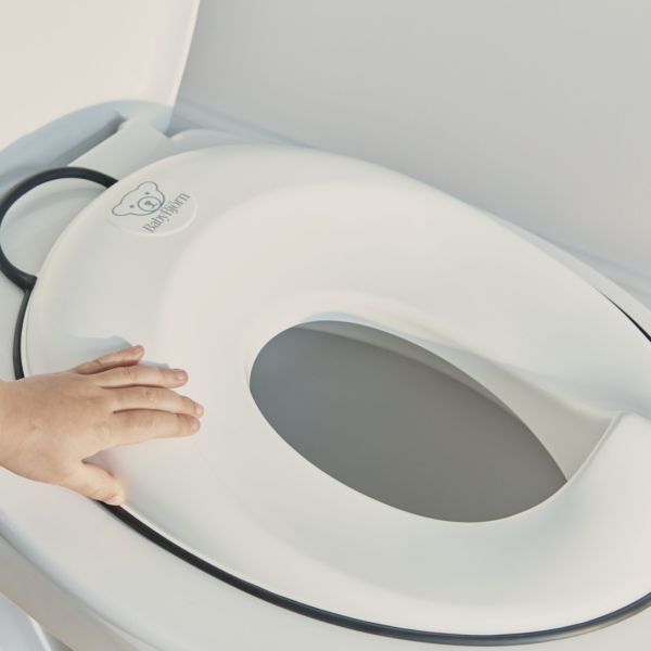 Réducteur de toilette blanc et noir