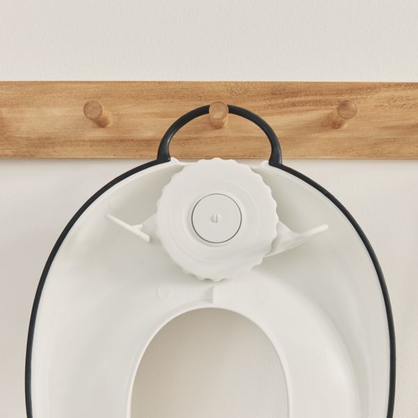 Réducteur de toilette blanc et noir