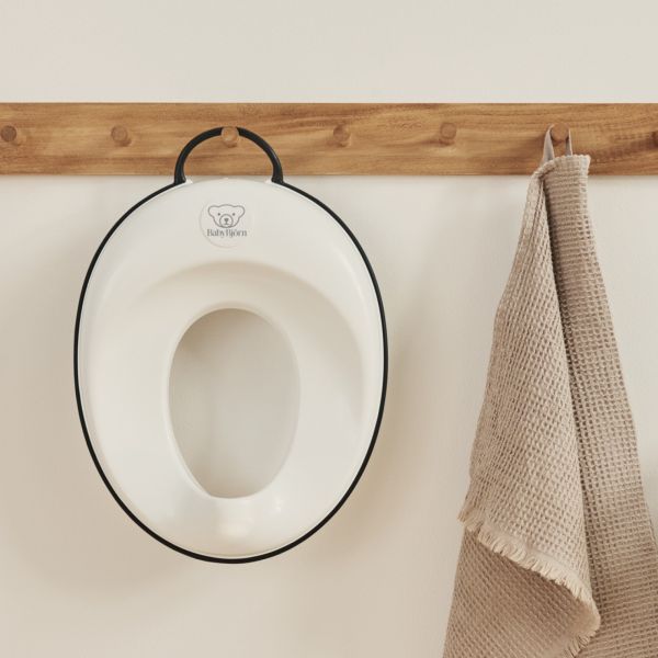 Réducteur de toilette blanc et noir